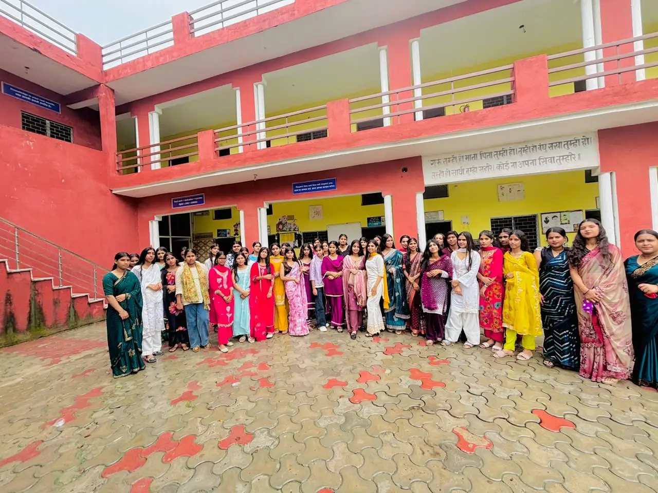 Students and teachers in the school courtyard